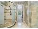 Elegant bathroom featuring a glass-enclosed shower and neutral tile surround at 3574 N Druid Hills Rd, Decatur, GA 30033