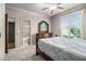 Serene bedroom with an ensuite bathroom, large window, and walk-in closet at 3574 N Druid Hills Rd, Decatur, GA 30033