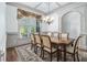 Formal dining room with wainscoting, chandelier, and elegant dining set at 3574 N Druid Hills Rd, Decatur, GA 30033