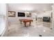 Grand game room features a pool table, wet bar, baby grand piano, and marble flooring at 3574 N Druid Hills Rd, Decatur, GA 30033