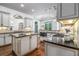 Spacious kitchen featuring granite countertops, custom cabinets, island, and modern appliances at 3574 N Druid Hills Rd, Decatur, GA 30033