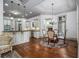 Spacious kitchen and breakfast area featuring granite countertops, stainless appliances, and hardwood floors at 3574 N Druid Hills Rd, Decatur, GA 30033