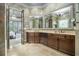 Expansive main bathroom featuring a double vanity, tile floors, and decorative mirror at 3574 N Druid Hills Rd, Decatur, GA 30033