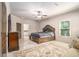 The main bedroom boasts a luxurious bed, and ensuite bathroom access at 3574 N Druid Hills Rd, Decatur, GA 30033