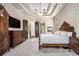 Luxurious main bedroom features tray ceilings, fireplace, and ample space at 3574 N Druid Hills Rd, Decatur, GA 30033