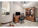 Well-lit home office featuring a built-in desk and custom shelving at 3574 N Druid Hills Rd, Decatur, GA 30033