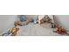 Spacious playroom features neutral carpet and an array of colorful toys at 3574 N Druid Hills Rd, Decatur, GA 30033