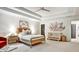 Serene bedroom with tray ceiling, ceiling fan and minimalist decor; the perfect Bedroom space at 1233 Miss Irene Ln, Lawrenceville, GA 30044