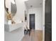 Contemporary entryway featuring light hardwood floors, a sleek decor, and a black interior door at 1233 Miss Irene Ln, Lawrenceville, GA 30044