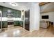 Bright kitchen featuring stainless appliances, green cabinetry, and hardwood floors at 1233 Miss Irene Ln, Lawrenceville, GA 30044