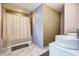 Well-designed bathroom featuring unique wall tiles, a vessel sink, and a shower with a patterned shower curtain at 241 Burke Cir, Mcdonough, GA 30253