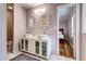 Elegant bathroom with double vessel sinks, ornate mirrors, cabinet storage, and a view into the bedroom at 241 Burke Cir, Mcdonough, GA 30253