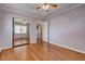 Light-filled bedroom with wood floors, closet, and natural light, offering a comfortable space at 241 Burke Cir, Mcdonough, GA 30253