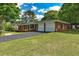 Brick ranch with a two car garage and well-maintained landscaping at 241 Burke Cir, Mcdonough, GA 30253