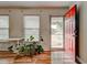 Inviting entryway featuring a bright red door and hardwood floors, creating a warm welcome at 241 Burke Cir, Mcdonough, GA 30253