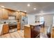 Beautiful kitchen with wood cabinets, stainless appliances, granite countertops, and hardwood flooring at 241 Burke Cir, Mcdonough, GA 30253
