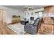 Cozy living room featuring a fireplace, large TV, comfortable seating, and hardwood flooring at 241 Burke Cir, Mcdonough, GA 30253