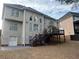 Spacious backyard with deck and stairs leading down from the two-story home's upper level at 3270 Moon Beam Ct, Snellville, GA 30039