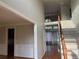 Open floor plan with hardwood floors, a staircase, and ample natural light at 3270 Moon Beam Ct, Snellville, GA 30039