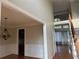 Open floor plan with hardwood floors, a staircase, and ample natural light at 3270 Moon Beam Ct, Snellville, GA 30039