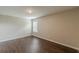 Bright bedroom with hardwood floors and a window at 4500 Nocohoma Bnd, Douglasville, GA 30135