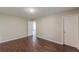 Bedroom with wood-look floors, neutral walls, and white doors and trim at 4500 Nocohoma Bnd, Douglasville, GA 30135