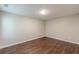 A simply decorated bedroom features wood-look floors, neutral walls, and white trim at 4500 Nocohoma Bnd, Douglasville, GA 30135
