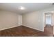 Spacious bedroom with hardwood floors and a view into the hallway at 4500 Nocohoma Bnd, Douglasville, GA 30135