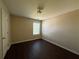 Neutral bedroom with a window for natural light and dark laminate flooring at 4500 Nocohoma Bnd, Douglasville, GA 30135