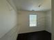 Spacious closet with ample shelving and natural light from the window at 4500 Nocohoma Bnd, Douglasville, GA 30135