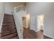 Open entryway with hardwood floors, a staircase and access to other rooms at 4500 Nocohoma Bnd, Douglasville, GA 30135
