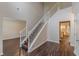Open entryway featuring hardwood floors, staircase and access to other rooms at 4500 Nocohoma Bnd, Douglasville, GA 30135