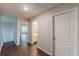 Hallway with wood floors and doors leading to a bathroom and bedroom at 4500 Nocohoma Bnd, Douglasville, GA 30135