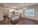 Bright eat-in kitchen features granite countertops, stainless steel appliances, and hardwood floors at 4500 Nocohoma Bnd, Douglasville, GA 30135