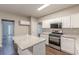 Spacious kitchen featuring granite island, modern appliances and hardwood floors at 4500 Nocohoma Bnd, Douglasville, GA 30135