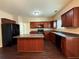 Well-equipped kitchen with stainless steel appliances, a center island, and hardwood floors at 4500 Nocohoma Bnd, Douglasville, GA 30135
