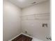 Laundry room featuring wire shelving and hardwood floors at 4500 Nocohoma Bnd, Douglasville, GA 30135