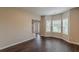 Bright living room with large bay windows and hardwood floors offers ample natural light at 4500 Nocohoma Bnd, Douglasville, GA 30135