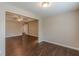 Living room with ceiling fan, wood-look floors, and ample natural light at 4500 Nocohoma Bnd, Douglasville, GA 30135