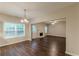 Open living room with a fireplace, and hardwood floors bathed in natural light at 4500 Nocohoma Bnd, Douglasville, GA 30135