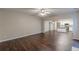 Open-concept living room with hardwood floors that flows into kitchen at 4500 Nocohoma Bnd, Douglasville, GA 30135
