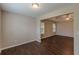 Open-concept living room featuring modern lighting and neutral walls at 4500 Nocohoma Bnd, Douglasville, GA 30135