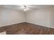 Spacious living room featuring wood-look flooring and a ceiling fan at 4500 Nocohoma Bnd, Douglasville, GA 30135
