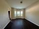 Bright living room featuring a bay window offering plenty of natural light and hardwood floors at 4500 Nocohoma Bnd, Douglasville, GA 30135