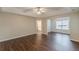 Main bedroom with tray ceilings, wood-look flooring, and natural light at 4500 Nocohoma Bnd, Douglasville, GA 30135
