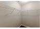 Walk-in closet with white wire shelving and wood-look floors at 4500 Nocohoma Bnd, Douglasville, GA 30135