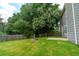 Backyard features green lawn and tall trees at 1265 Birchwood Ln, Roswell, GA 30076