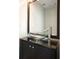Stylish bathroom vanity featuring a vessel sink, modern faucet, and black cabinet at 1265 Birchwood Ln, Roswell, GA 30076