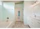 Lovely bathroom featuring tile floors, and white cabinets at 1265 Birchwood Ln, Roswell, GA 30076
