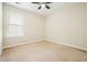Bedroom with neutral carpet and ceiling fan at 1265 Birchwood Ln, Roswell, GA 30076